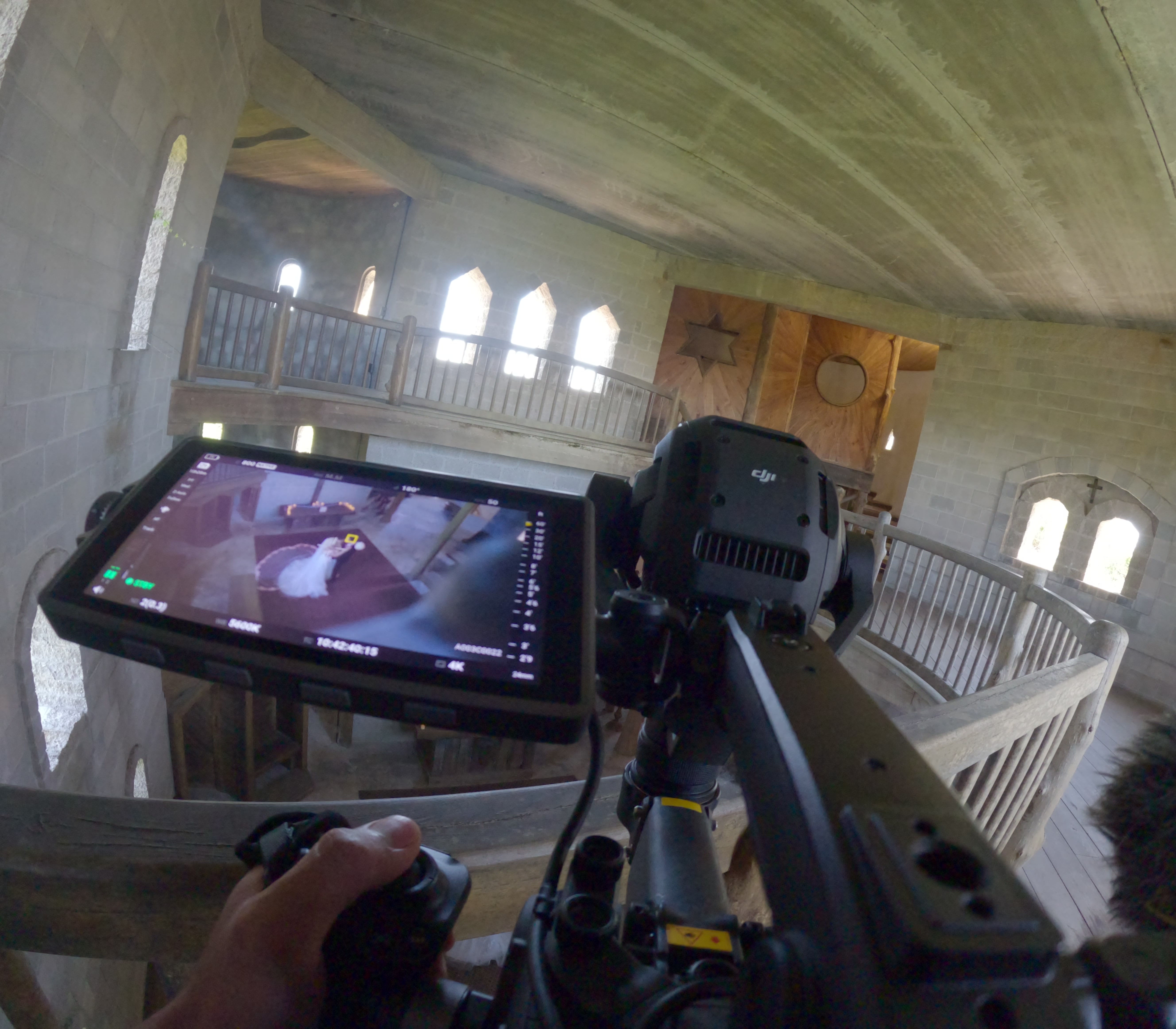 Wide angle GoPro view of a DJI Ronin 4D 6K overlooking a wedding ceremony